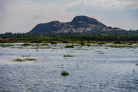 Rocky hill beyond a wetland near Soroti in Uganda