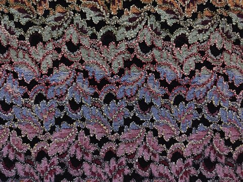 Texture textile multicolore &agrave; motif ajour&eacute; avec effet dentelle graphique