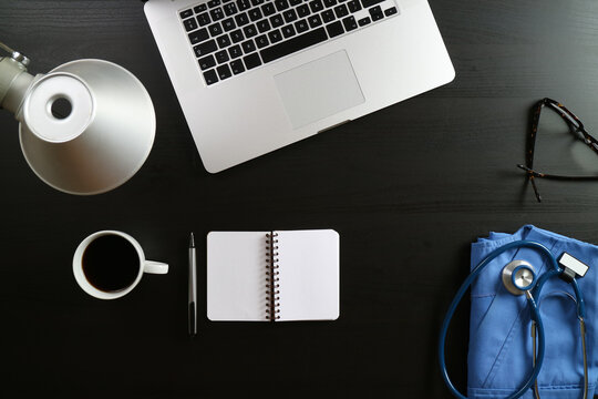 Modern Medical Workspace with Laptop, Coffee and Stethoscope