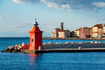 A red lighthouse in the historic Old town of Piran, Slovenia © Boris Stroujko
