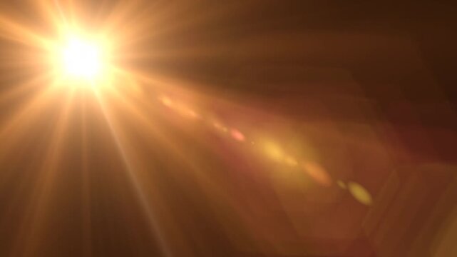 optical shine light lens flares animation on black background.