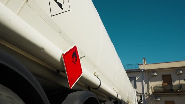 Tanker truck refuels European gas station during fuel shortage crisis