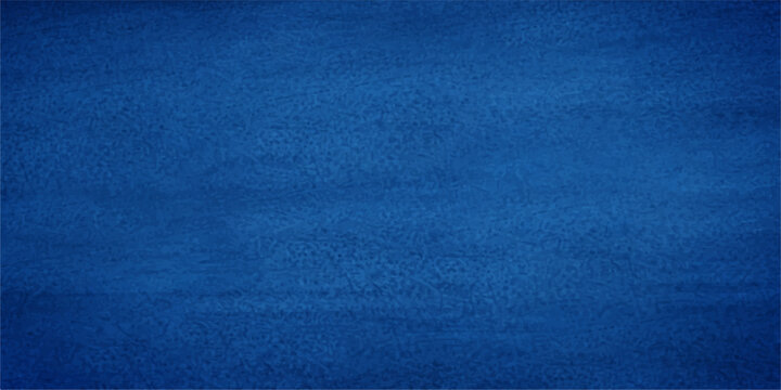 A closeup of dark blue denim fabric texture with a rough cotton textile pattern creates a textured clothing material backdrop for fashion design and wallpaper