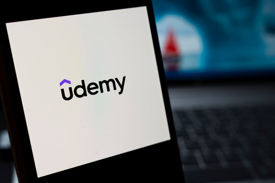 Warsaw, Poland - April 10, 2026: Close-up view of the Udemy logo on a smartphone screen, symbolizing online education and e-learning platforms.
