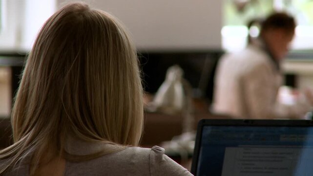 woman out of focus in library