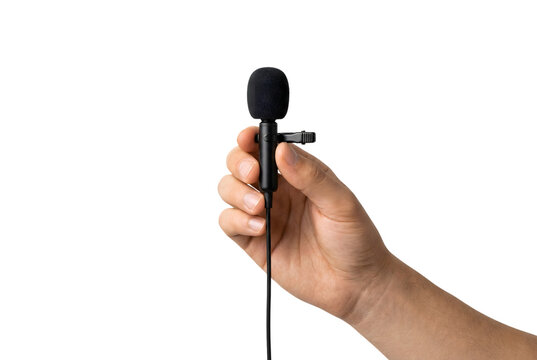 Hand holding a small clip-on lavalier or lapel microphone. Isolated on transparent background, png