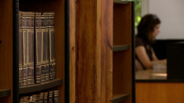 woman out of focus in library