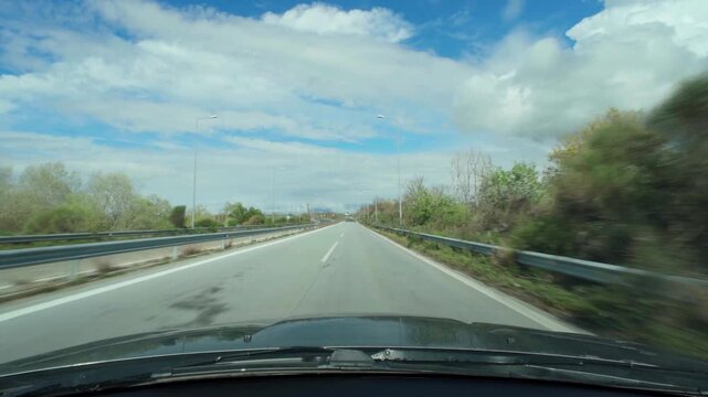 driving on an empty road in spring
