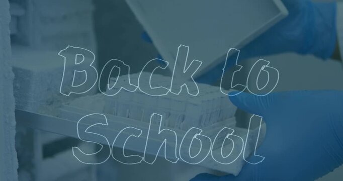 Animation of back to school text over scientist in lab