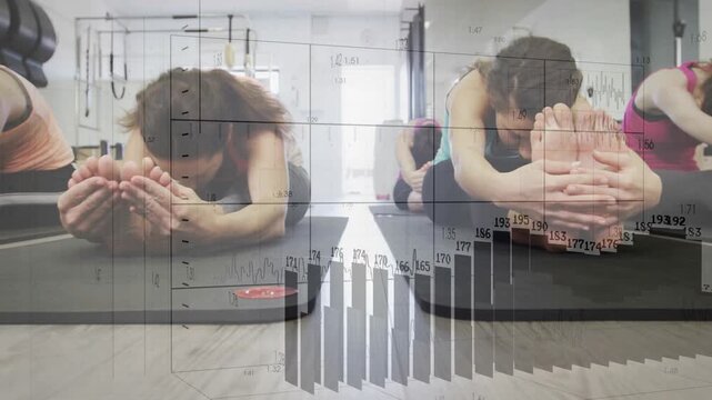 On cue two women folding forward on fitness mats holding deepening stretch as faint graphs overlay