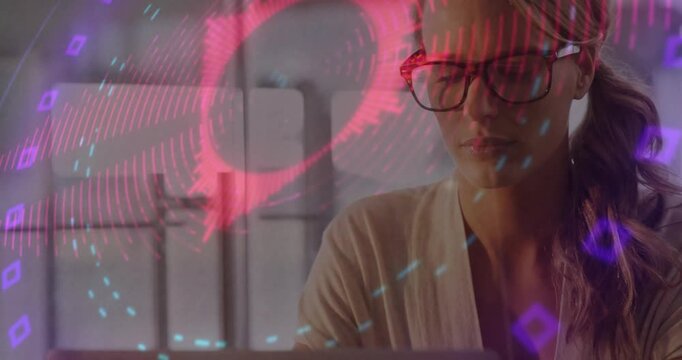 Woman at desk glancing at laptop and starting round rings appearing on specs while checking metrics