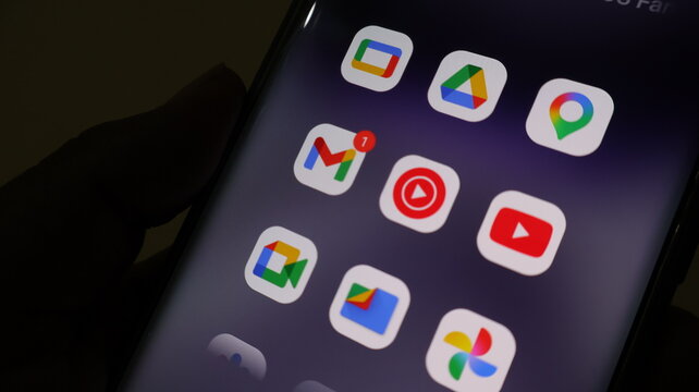 A smartphone screen displaying various app icons in a dark setting