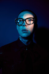 Fototapeta premium Bold expression in stylish attire captures a handsome mans charm against a vivid backdrop