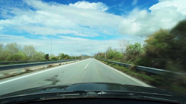 driving on an empty road in spring