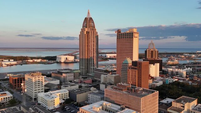 Cinematic aerial drone footage of Mobile, Alabama featuring the downtown skyline, waterfront, and port along the Gulf Coast. Ideal for travel, business, and urban establishing shots.