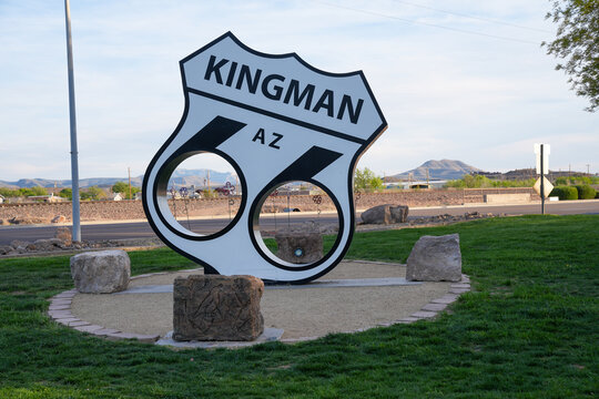 Kingman, Arizona - March 28, 2026: Welcome sign for Kingman Arizona and Route 66 in a park, with the highway emblem
