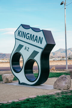 Kingman, Arizona - March 28, 2026: Welcome sign for Kingman Arizona and Route 66 in a park, with the highway emblem