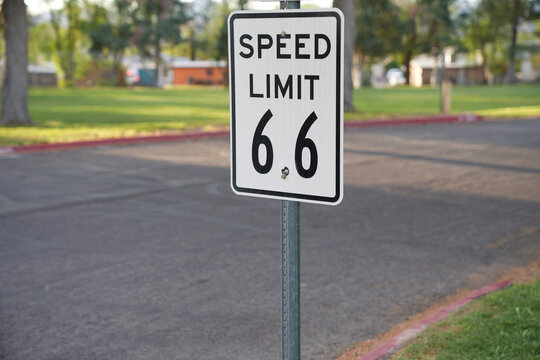 Kingman, Arizona - March 28, 2026: Odd 6.6 speed limit sign in a park along Route 66, designed to make drivers pay attention