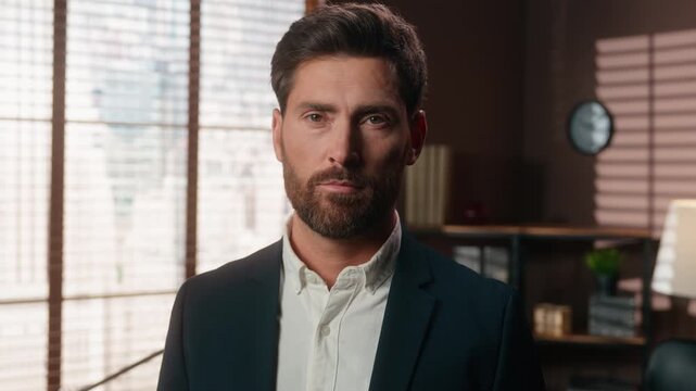 Serious Caucasian middle-aged business man nod head agree looking at camera adult calm businessman 40s male answering yes answer positive executive satisfied agent nodding agreeing support in company
