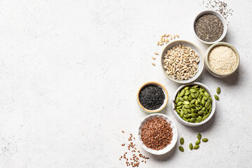 Assortment of seeds in bowls for healthy eating