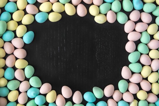 Colorful Pastel Easter Eggs Forming a Frame on Black Background