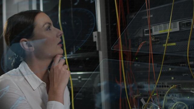 Tech holding yellow cable at chin and tracing rack, causing live lines tracing cables in datacenter