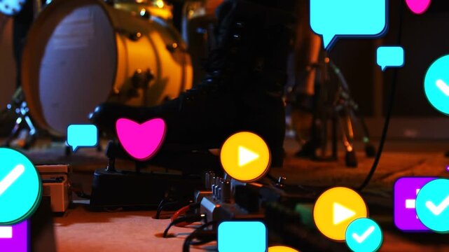 Musician booted foot pressing pedal, colorful icons emerging and filling board showing engagement
