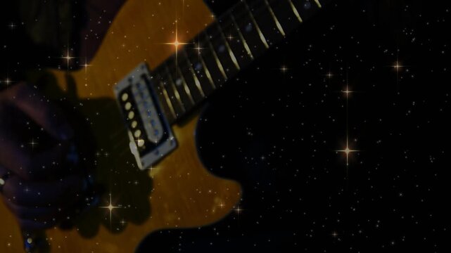 Guitarist entering frame and picking electric guitar for music, star overlay behind guitar