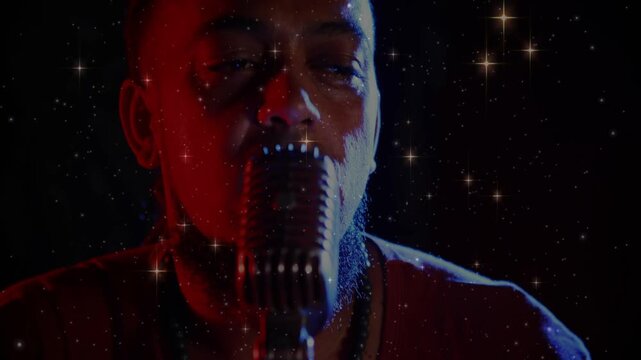 Mic moving in, camera revealing face, vocalist leaning, singing music, star-overlay crossing face