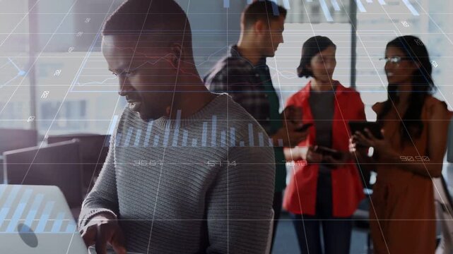 Man typing laptop and starting business chart overlay while team tapping pads sharing data smiling