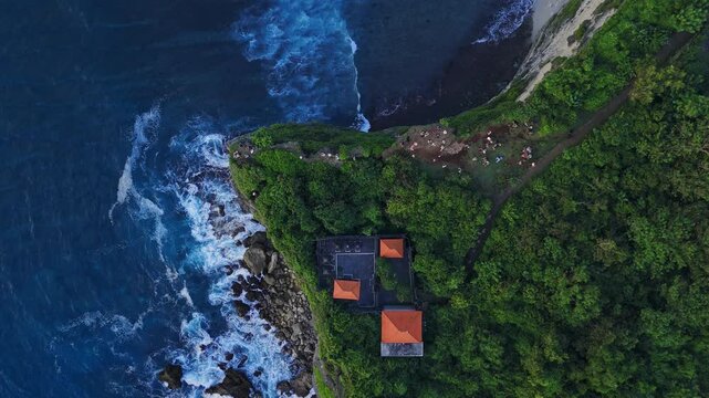 Scenic coastline with cliffs and ocean with waves in Bali. Uluwatu drone view, top down