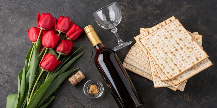 Fresh red roses paired with a plate of matzo and a pair of scissors