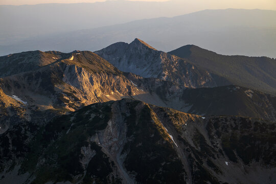 Landscape from the highest peak of Pirin Mountain. View from Vihren summit during sunrise in summer season.