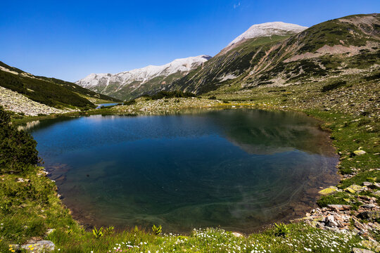  Mountain lake, calm water in Pirin mountain. National park in Bulgaria.