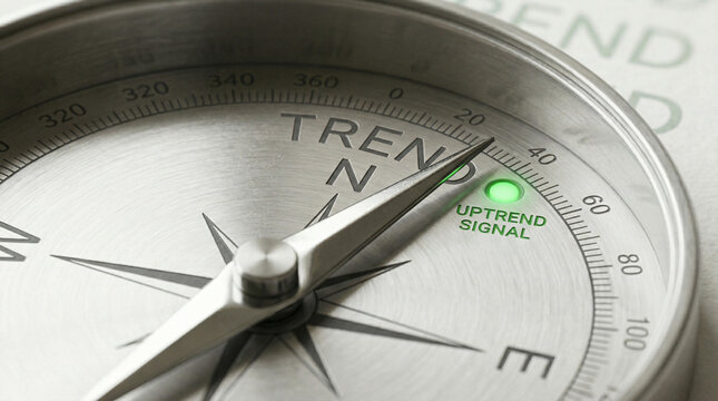 Close-up of a compass pointing to uptrend signal active business concept