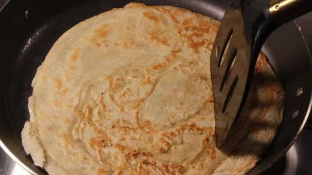 4K 4x Slow Motion Flipping Toasted Crepe with Spatula