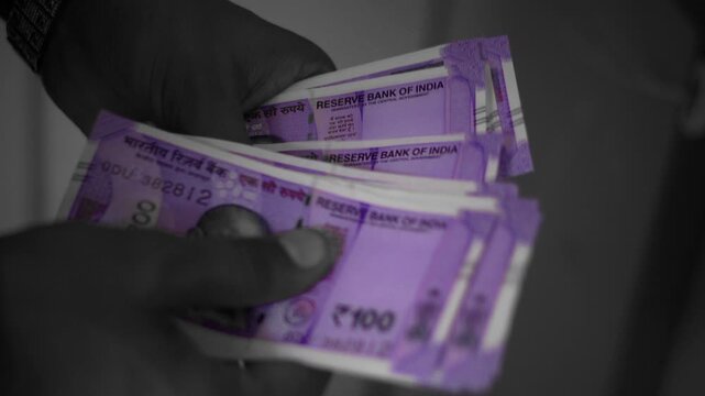 Indian 100 Rupee Notes Dispensing from ATM Machine Close-Up black and white fooage 