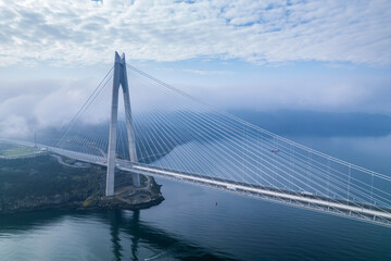 Obraz premium Yavuz Sultan Selim Bridge in Istanbul, Turkey. 3rd bridge of Istanbul Bosphorus. Foggy weather.
