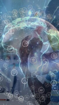 Vertical video: Kids leaning to device activating AR globe orbiting icons over faces in edtech