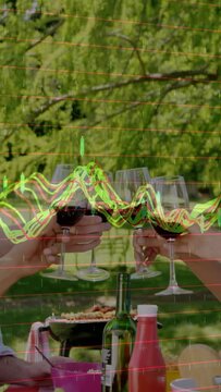 Vertical video: Two hands raising starting group toasting picnicking neon waves crossing glasses