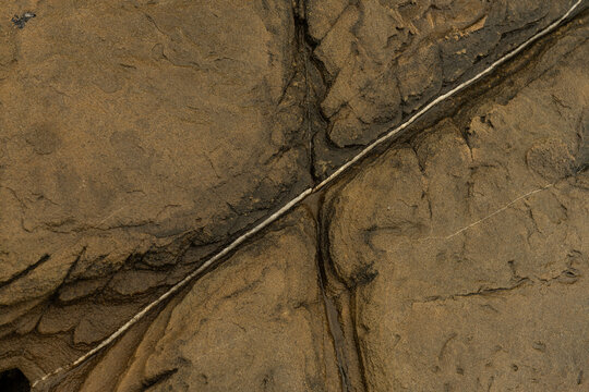 Sandstone surface with natural cracks at Punta Carnero Algeciras Cadiz