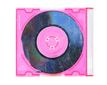 Pink CD jewel case with scratched disc, isolated on white background