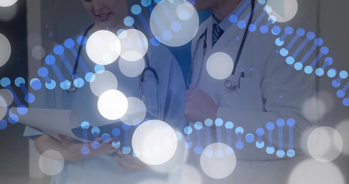 Female and male clinicians flipping blue folder in clinic, DNA helix and bokeh marking patient case