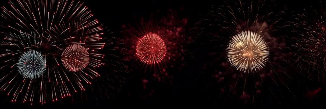 Fireworks - patriotic fourth of july firecracker display exploding in the night sky with red, white, and blue sparkles