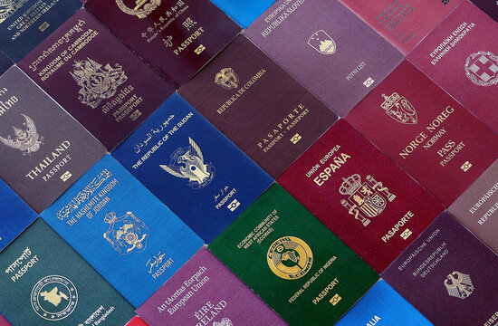 Big amount of passport covers from many biometrical passports close up. Travel concept