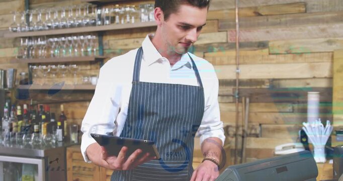 The waiter is working at the counter in the caf&eacute;