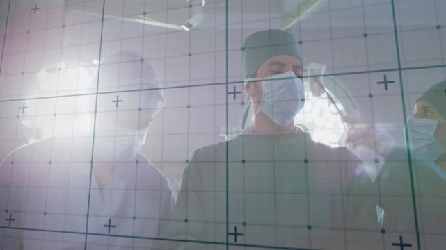 Three surgeons handling forceps through grid overlay glass, displaying animated health data charts