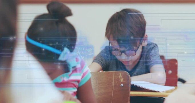 Cam widening girl writing revealing boy with specs leaning, reading workbook grid marking classwork