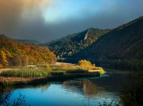 The West Morava River flowing through the Ovcar-Kablar Gorge in western Serbia. Autumn landscape with colorful leaves.
