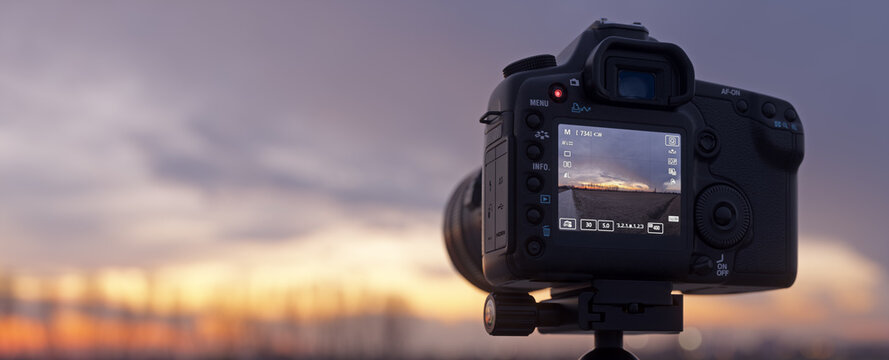 Close-up of a DSLR camera from the back, showing the LCD screen. 3D Realistic render.